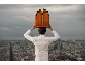 Travel backpack with flap in orange lifestyle